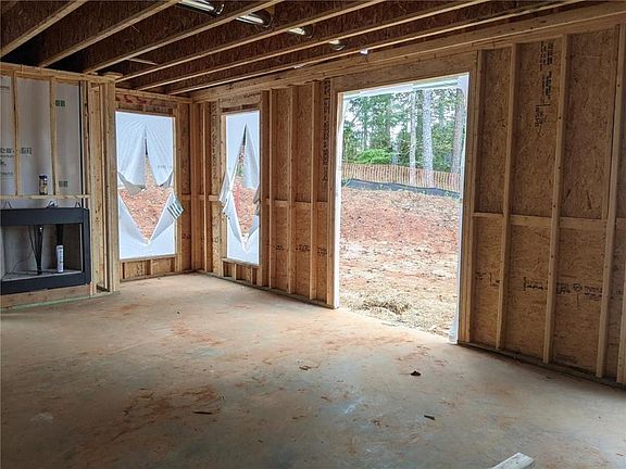 FAMILY ROOM w fireplace, huge windows through out, you can see the protected tree area next to the u