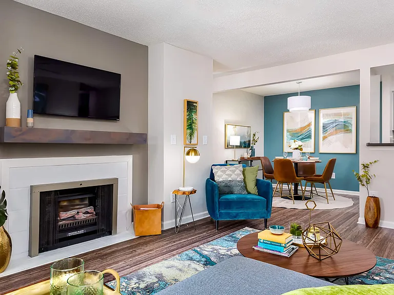 Open Living Room with Modern Gas Fireplace and Accent Wall leading to Dining Area - Diamond Interior
