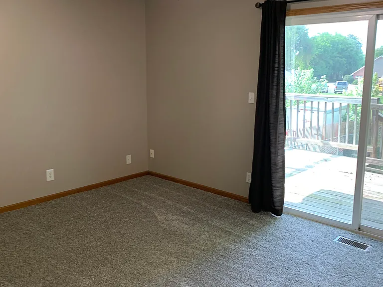 Main Bedroom with sliding door to a deck.