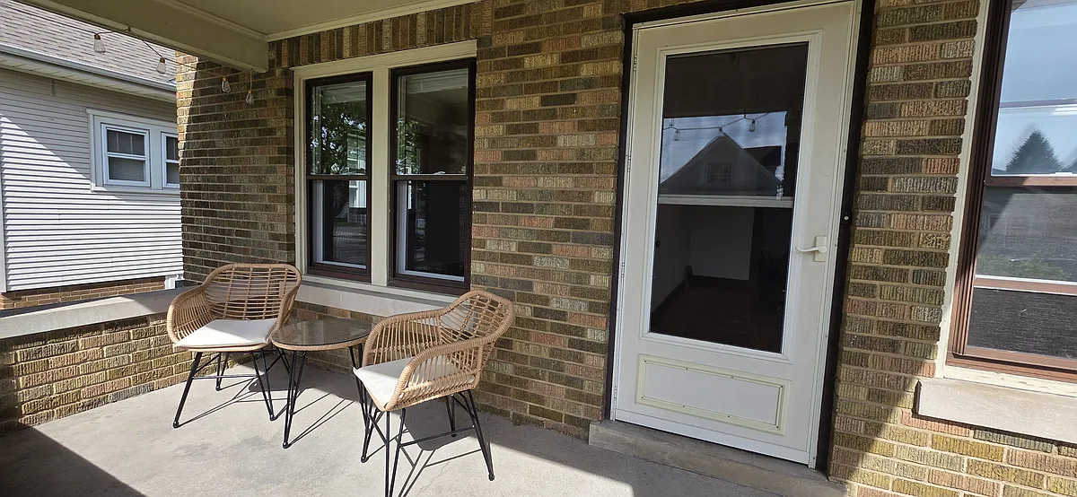 Large front porch with furniture included for enjoying summer! - 2119 Lasalle St