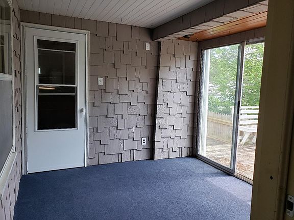 enclosed porch/breezeway between garage and kitchen entry. everybody loves this space