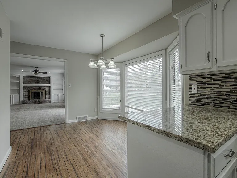 Eat-in kitchen flows directly from the kitchen into the adjoining family room.