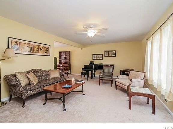 Living Room from front hallway. Dining Room to left.