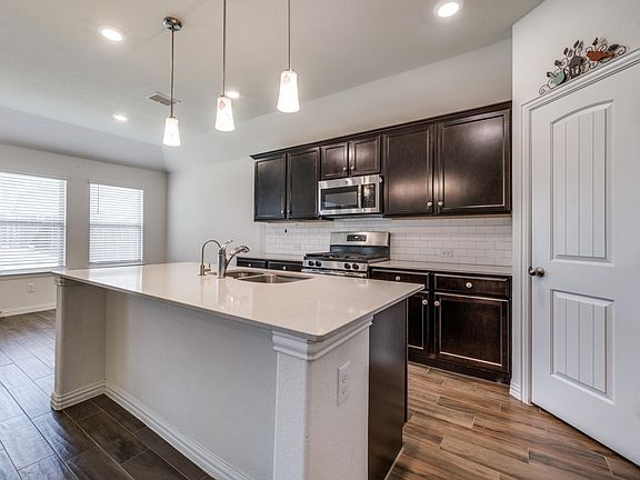 Kitchen with stainless steel appliances. Refrigerator included!