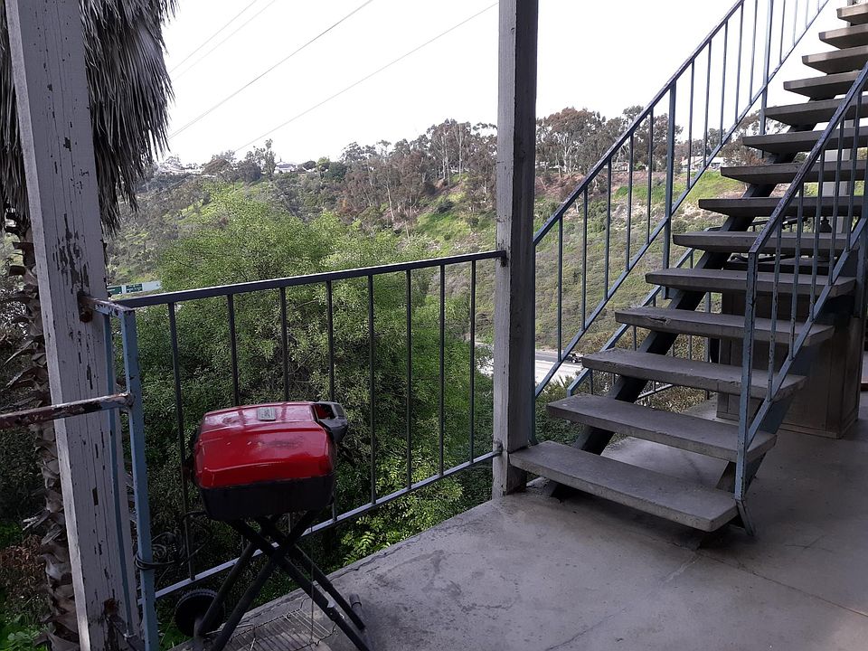 Balcony overlooking canyon outside front door of unit.