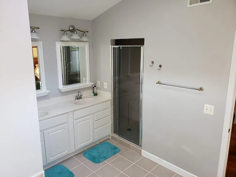 Master Bathroom- his and hers sinks and his and her shower in shower stall (upper level)