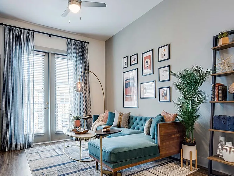 Griffis Frisco apartment living room with wood style floor.