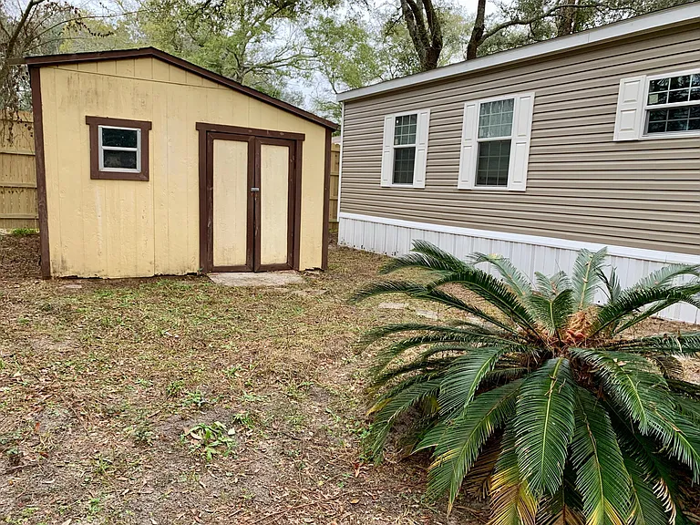 large shed on side of house