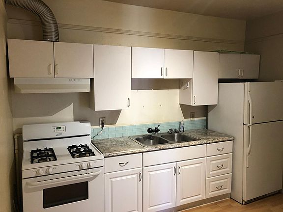 Updated kitchen with new sink, counter top, newer refrigerator and gas stove/oven. Not shown but washer and dryer are provided in the kitchen plus a small eating area.