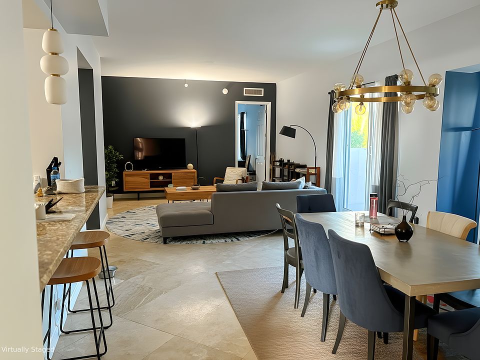 Virtually staged. You can have 2 living areas and a full dining area.
