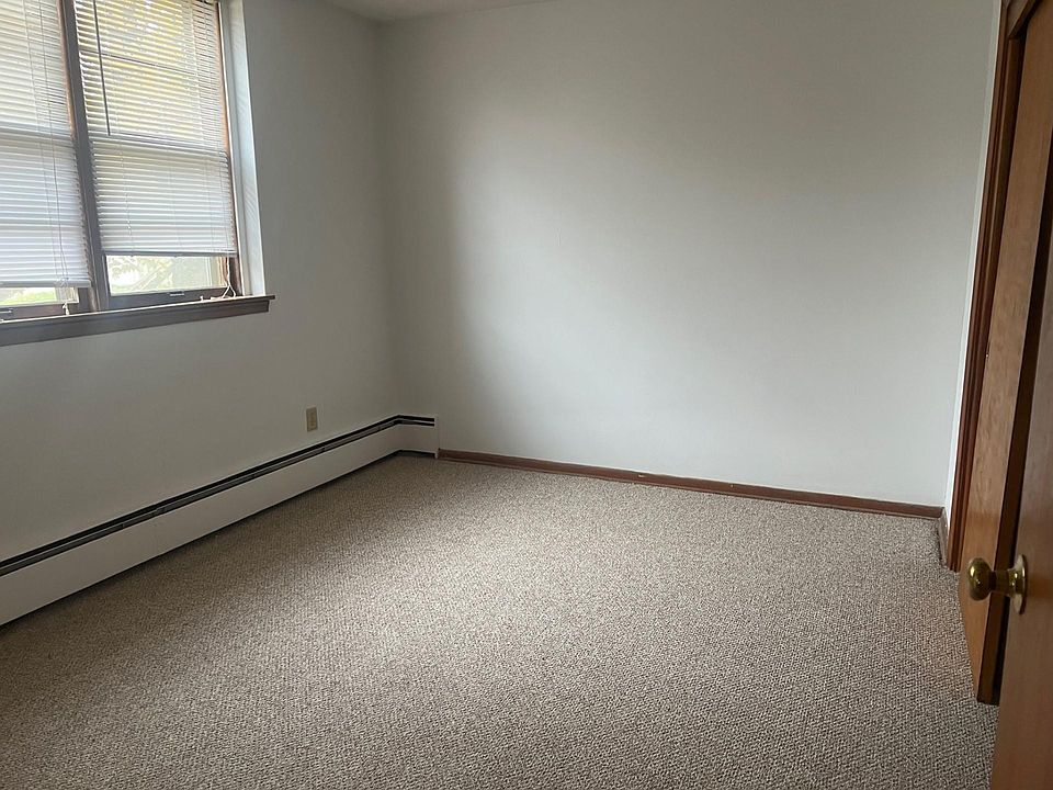 The bedroom with new carpet and new paint. The closet is on the left.