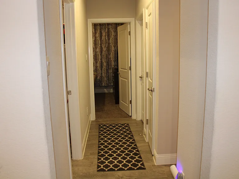Hallway leading to bedrooms and laundry room