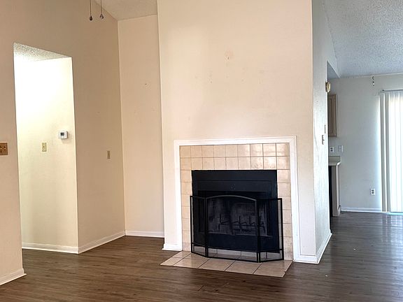 Living Room with Fireplace and Luxury Vinyl Flooring throughout