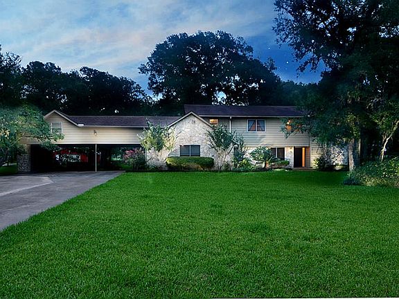 Night settles over Pecan Estates. A mosaic of stone tablets fuse together naturally with wood to blend power and nature, it's brawn subdued and balanced with colorful and lush landscaping. The fragrance of serenity envelopes your senses.