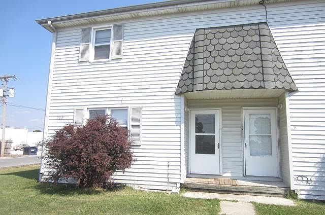 This propertys front door is on the left it is an end unit.