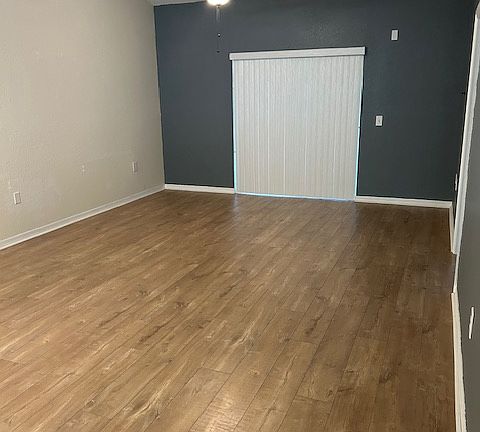 living area with sliding doors to lanai