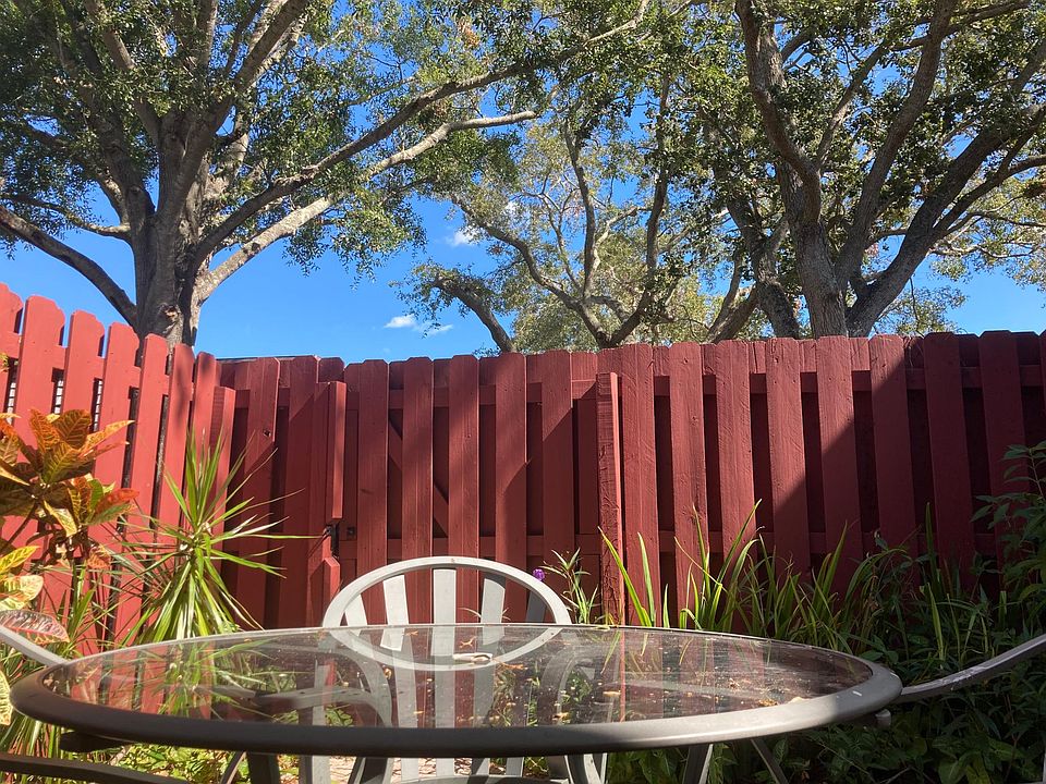 Patio enclosed with 6' fence under Oak trees