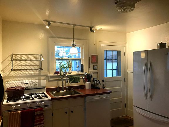 Kitchen, view of appliances (gas stove, dishwasher, sink with disposal, refrigerator, microwave)