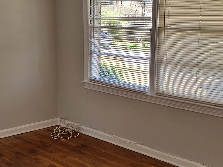 living room freshly painted with beautiful hardwood floors