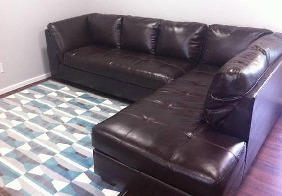 New leather couch with chase in living room