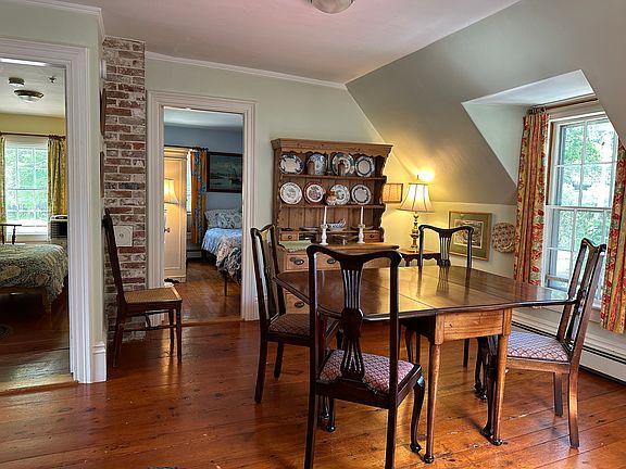 Coming into the Dining Room from the Kitchen. The Yellow Bedroom and the Blue Bedroom are on your left as you enter. The Georgian dining table has English and American chairs. The 19th C. English dresser holds part of Cathy's dish collection.