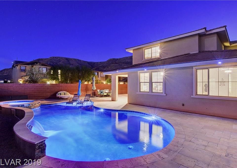 Incredible mountain views! Huge yard on a corner lot. Stunning saltwater pool&spa with pebble tec finishes, sheer descent waterfall, and travertine!