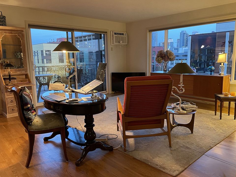 Living Room with slider out to east facing deck and picture window on the opposite corner facing south.