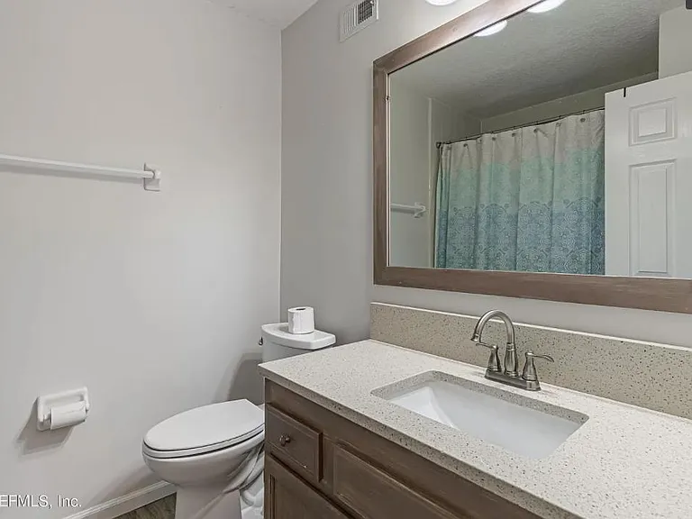 2nd bathroom with quartz countertop.