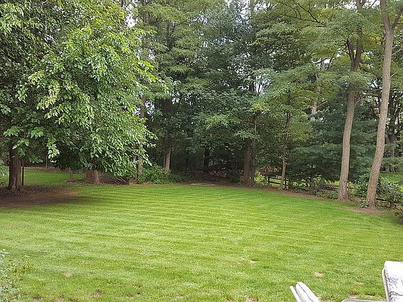Large backyard with firepit
