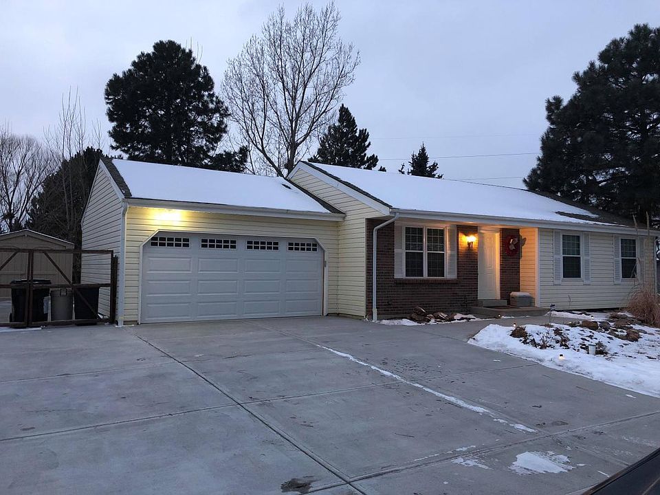 Front of house, 2 car garage, RV parking and large driveway