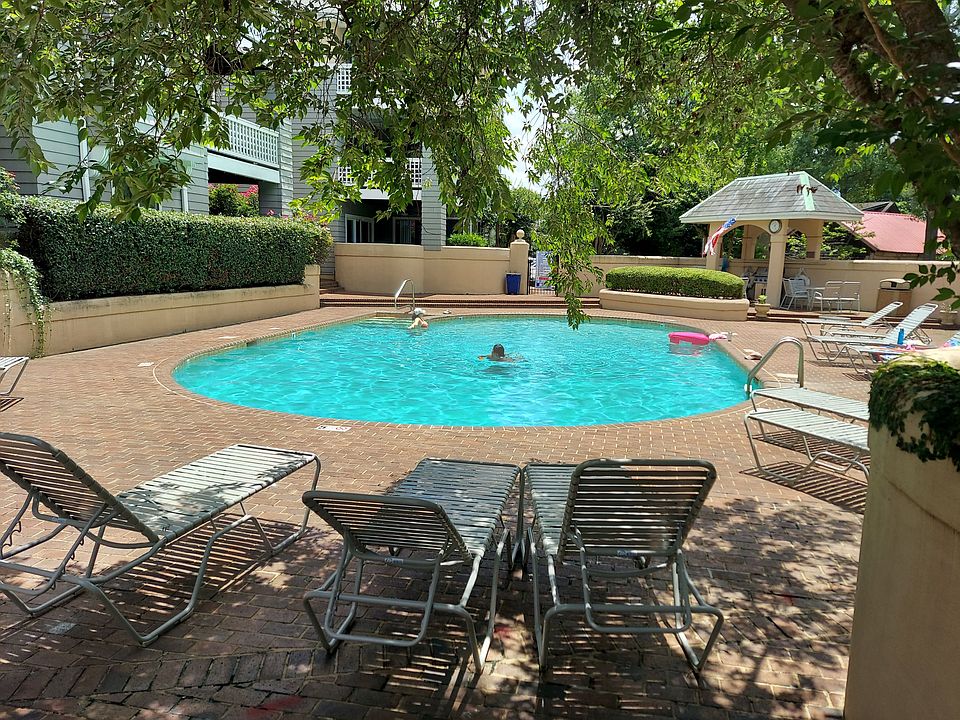 Step-in gunite pool, full paver surround, complete with lounge chairs included in this rental. C