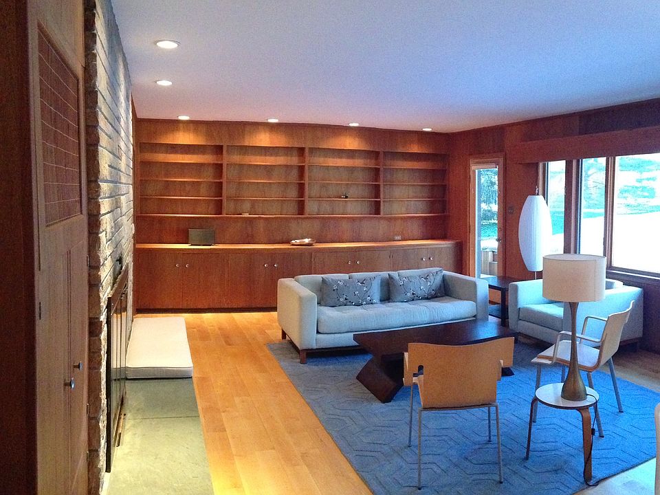 Living Room with fireplace and large picture window, door to