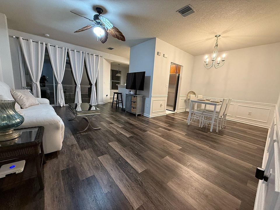 Living Room and combined formal dining room. There is also a kitchen nook area (breakfast area) on the other side of the kitchen.