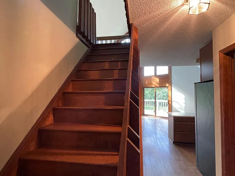 Stairs to loft and master bedroom.