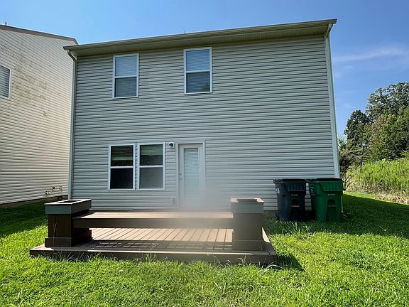 Back of the house with good size yard and deck.