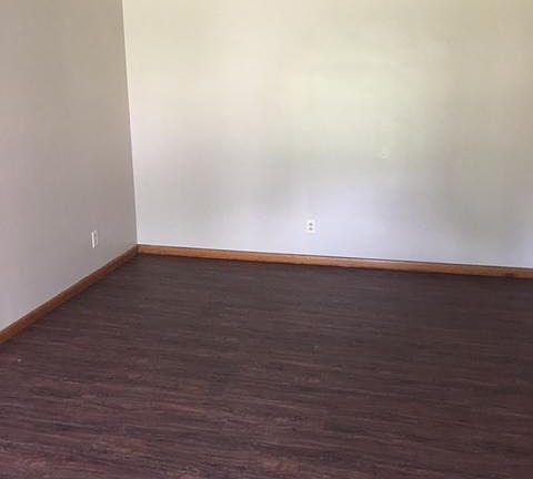 Living room with brand-new luxury vinyl plank flooring 