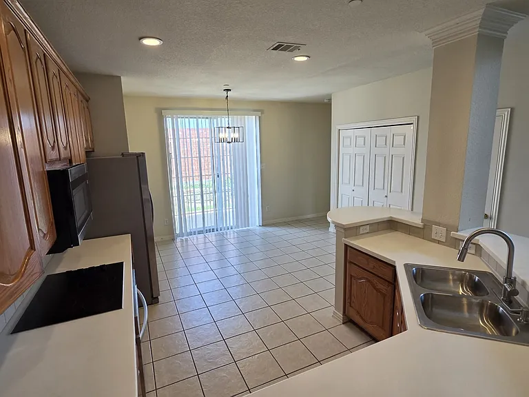 kitchen, dining area, leading to patio door