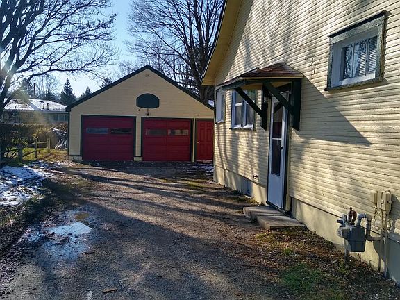 Side of House with Garage in Background