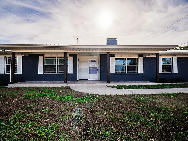 Stunning full front view of the home - wide lot with beautiful curb appeal