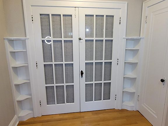 Built-in shelves and closet in living room