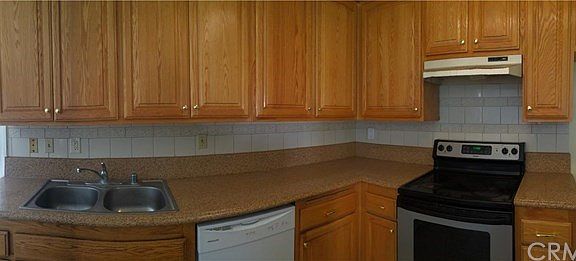 Updated kitchen with lots of storage, oak cabinets, tile bac