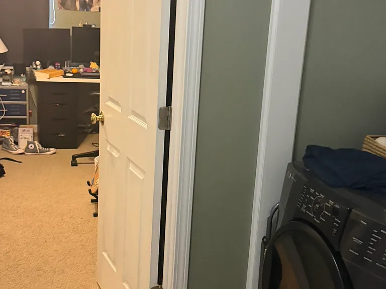 At top of stair looking into where 4th bedroom is and the washer and dryer area