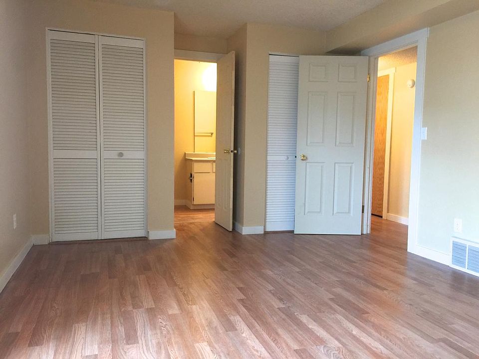 Bedroom with attached bath and french doors to pati