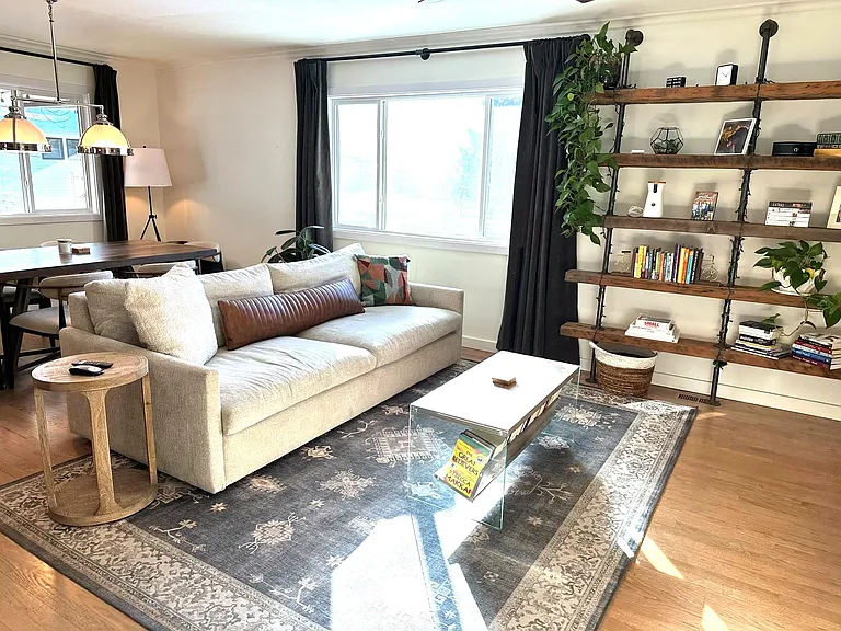 Living area adjacent to kitchen has lots of natural light