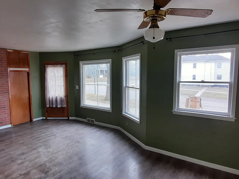 Main living/dining area with newer floors and many windows!