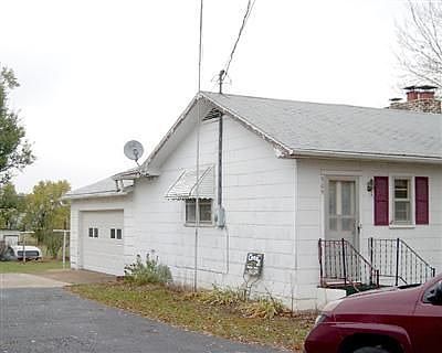 Attached 2 car garage with side entrance