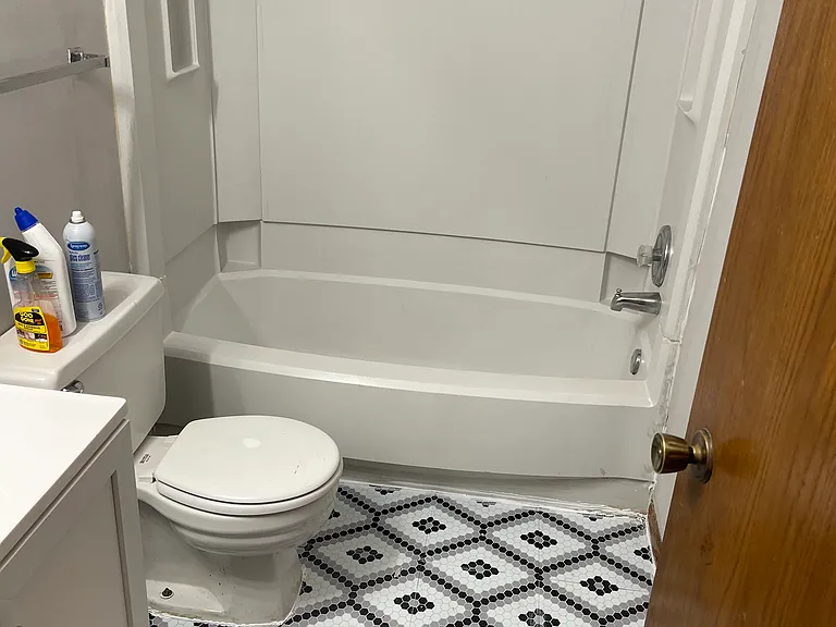 Bathroom with new flooring, vanity, sink and fixtures