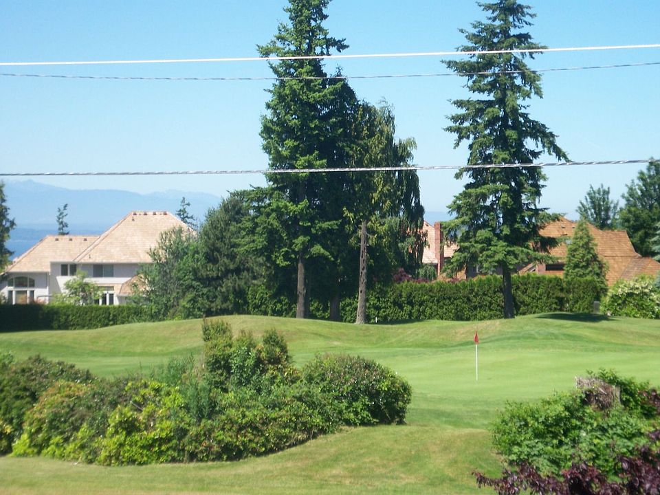View of golf course,sound and mountains