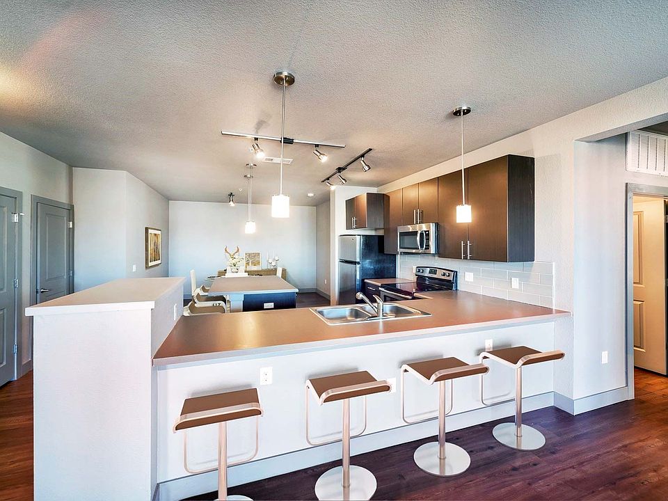 Kitchens with granite countertops and wood flooring