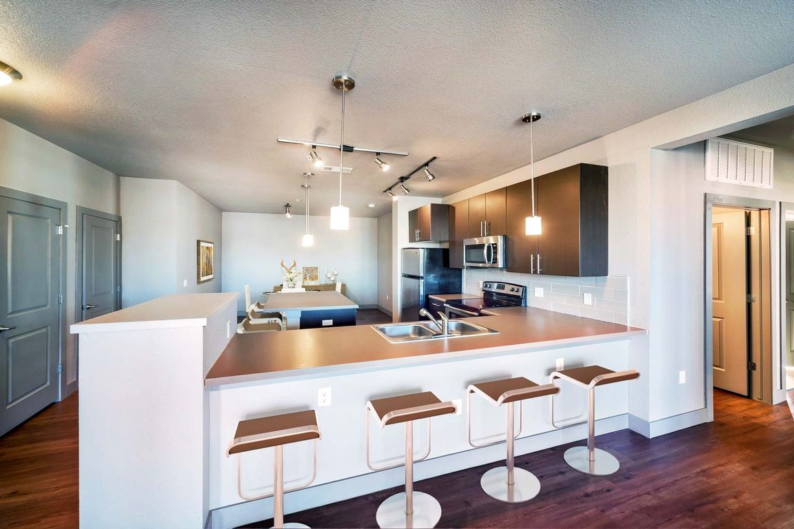 Kitchens with granite countertops and wood flooring